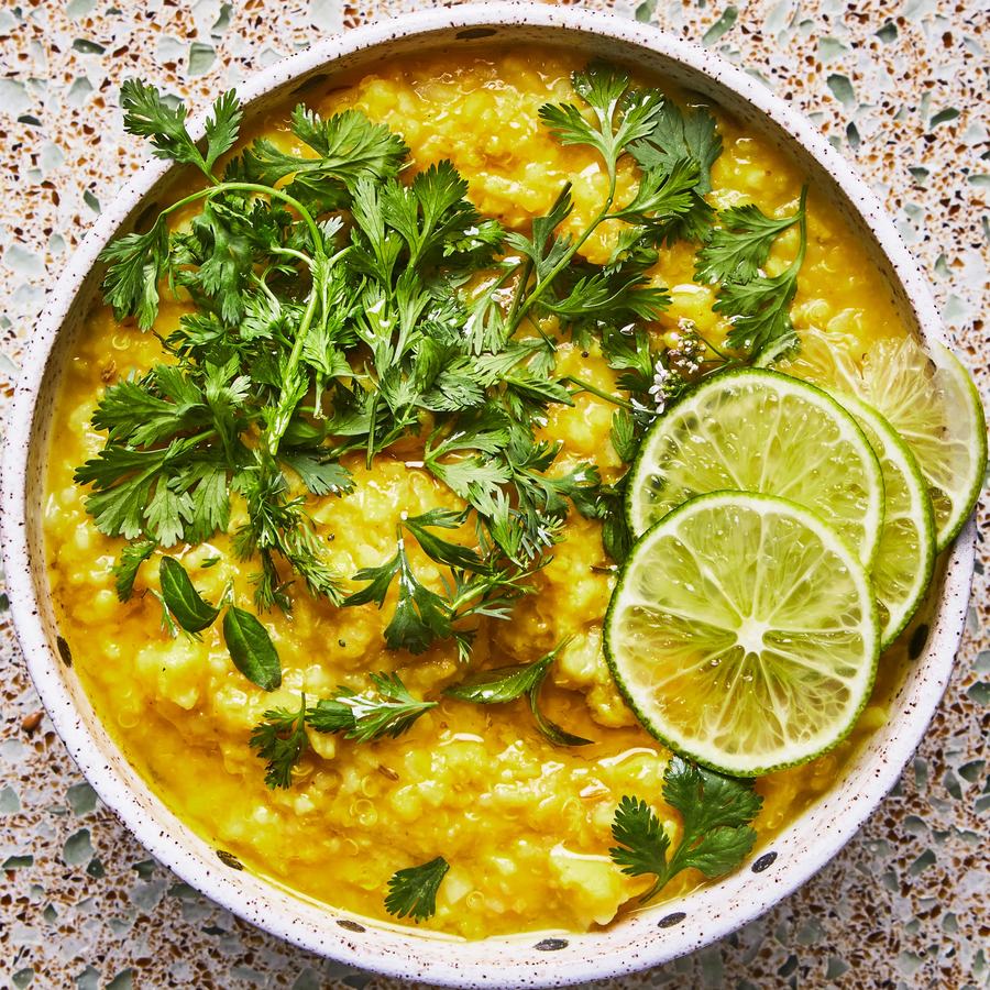 A bowl of kitchari with fresh coriander and lime