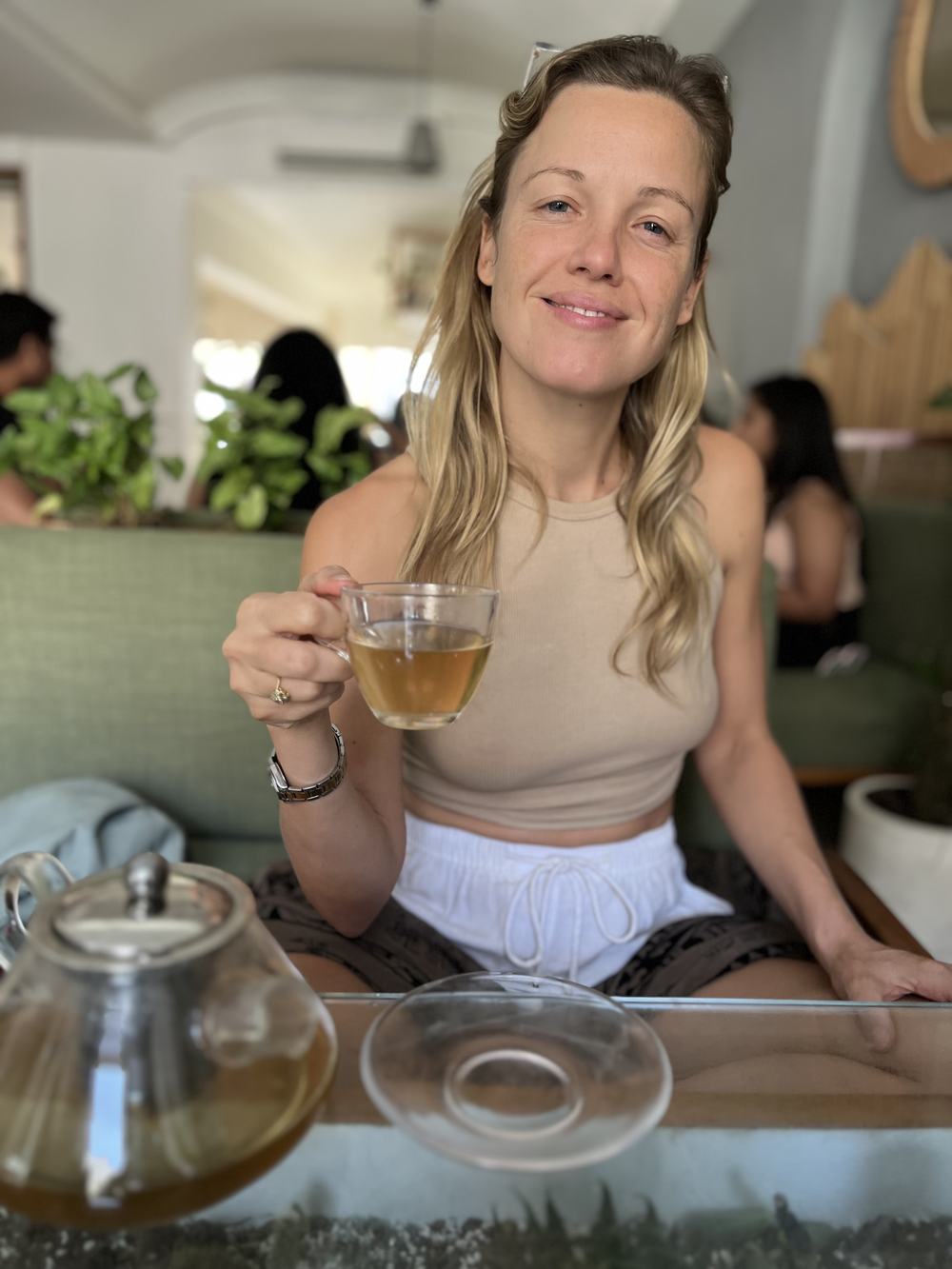 Jo holding a cup of herbal tea